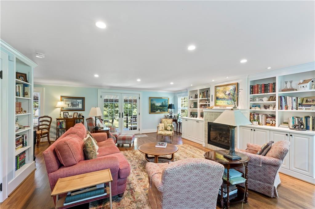 566 Dorseyville Road Pittsburgh, PA 15238 - Photo 19 of 48 a living room with fireplace furniture and a book shelf
