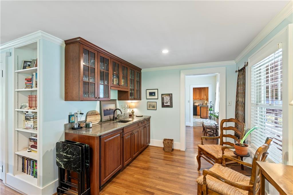 566 Dorseyville Road Pittsburgh, PA 15238 - Photo 22 of 48 a kitchen with stainless steel appliances granite countertop a stove top oven a sink dishwasher and wooden cabinets with wooden floor