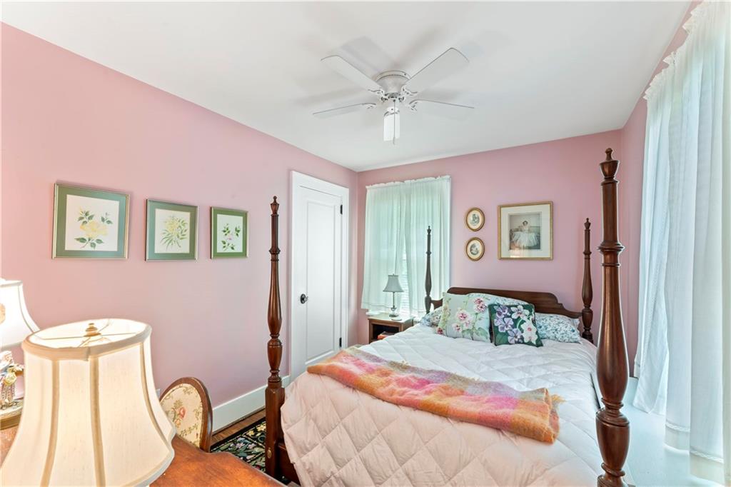 566 Dorseyville Road Pittsburgh, PA 15238 - Photo 24 of 48 a bedroom with a bed and a chandelier