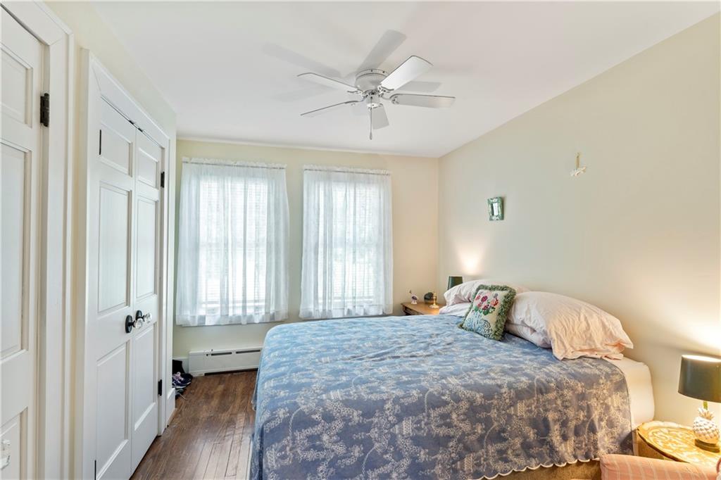 566 Dorseyville Road Pittsburgh, PA 15238 - Photo 30 of 48 a bedroom with a large bed and a chandelier