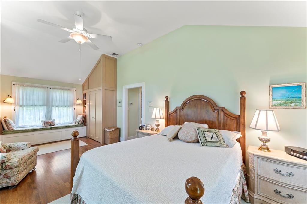 566 Dorseyville Road Pittsburgh, PA 15238 - Photo 32 of 48 a bedroom with a bed and a chandelier