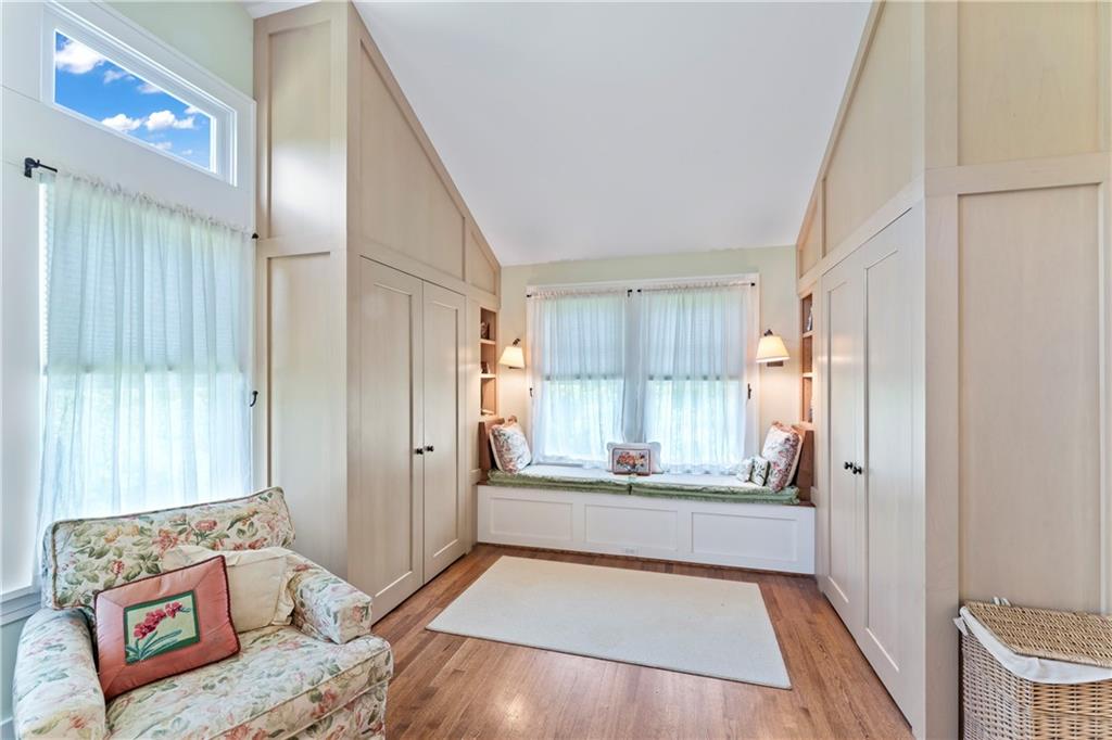 566 Dorseyville Road Pittsburgh, PA 15238 - Photo 33 of 48 a view of a hallway to an empty room with wooden floor and a window