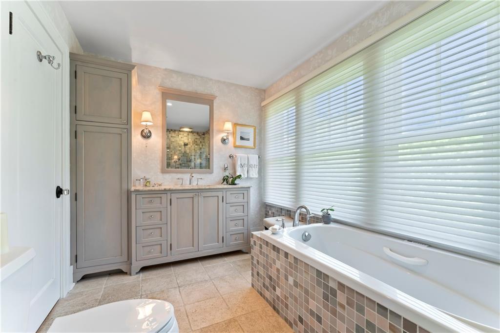 566 Dorseyville Road Pittsburgh, PA 15238 - Photo 34 of 48 a bathroom with a granite countertop tub sink and mirror