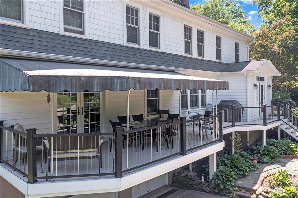 566 Dorseyville Road Pittsburgh, PA 15238 - Photo 41 of 48 a view of a building with chairs and table in a patio