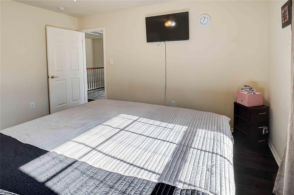 3609 Silverio Trail Bedford, TX 76021 - Photo 20 of 28 a bedroom with a bed and a flat screen tv