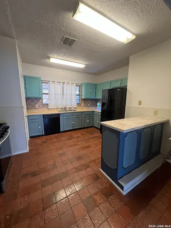 a room with a cabinets and bed