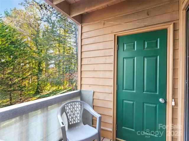 a view of yard with swimming pool and trees