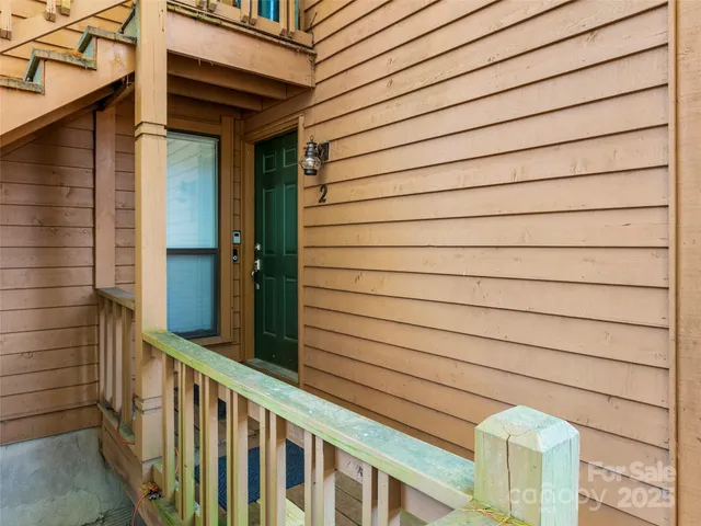 a view of front door of a house with stairs