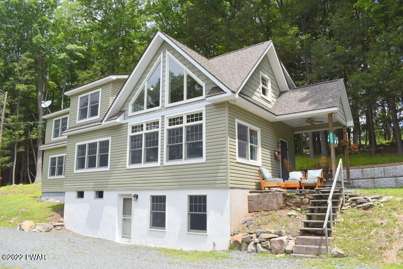 549 Finn Swamp Road Lakeville, PA 18438 - Photo 1 of 35 a view of a house with a yard and balcony