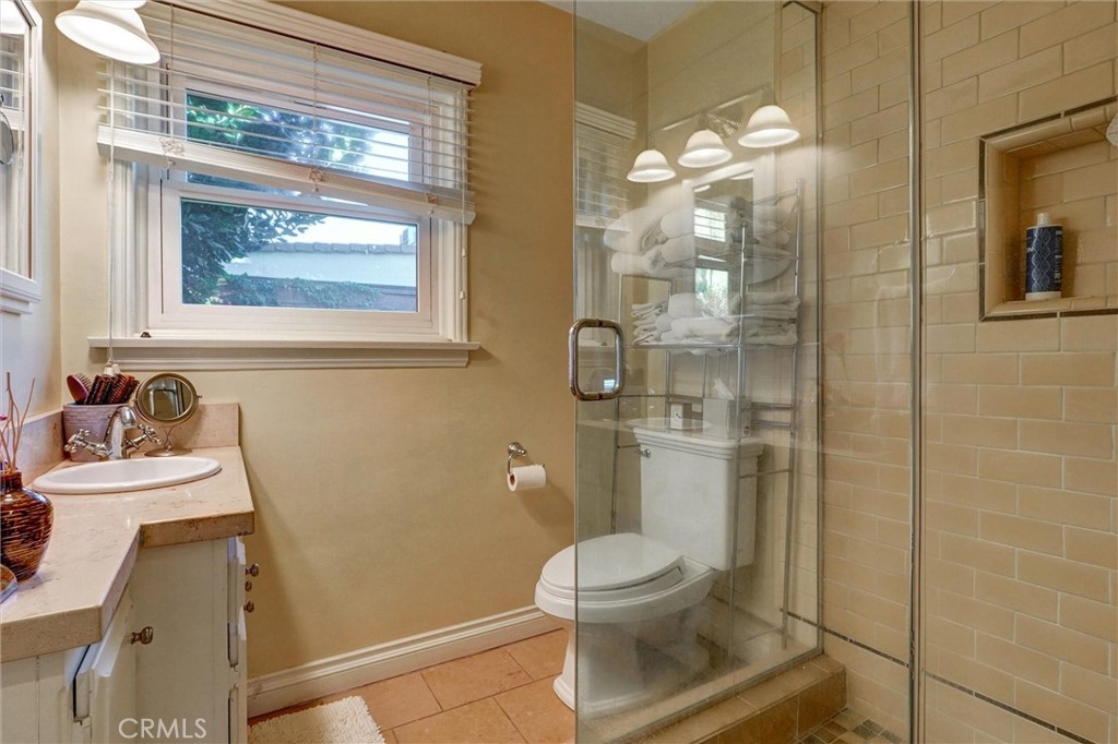 6649 Ranchito Avenue Van Nuys, CA 91405 - Photo 11 of 31 a bathroom with a toilet sink and shower