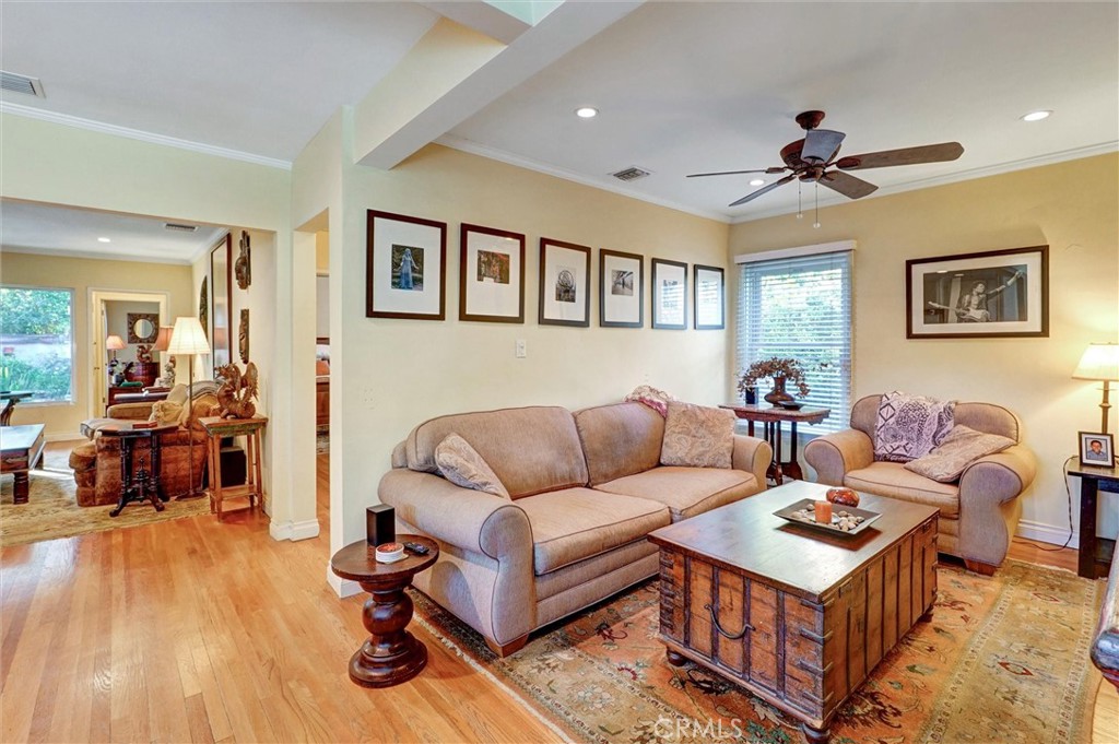 6649 Ranchito Avenue Van Nuys, CA 91405 - Photo 16 of 31 a living room with furniture and a wooden floor