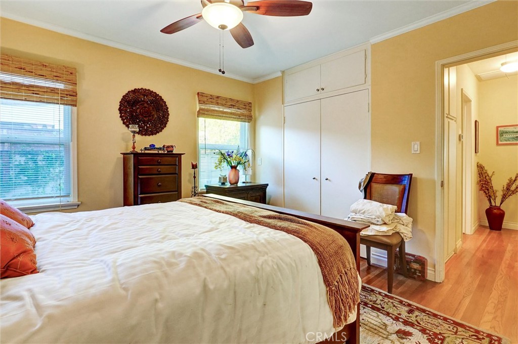 6649 Ranchito Avenue Van Nuys, CA 91405 - Photo 21 of 31 a bedroom with a bed and a chandelier