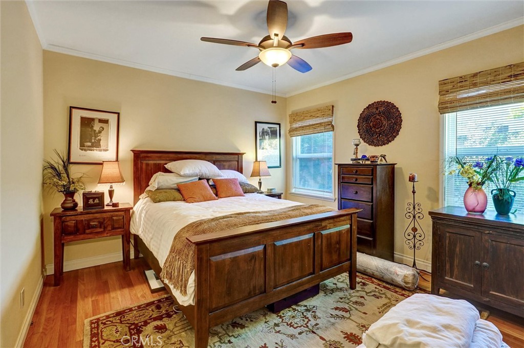 6649 Ranchito Avenue Van Nuys, CA 91405 - Photo 23 of 31 a bedroom with a bed and a chandelier