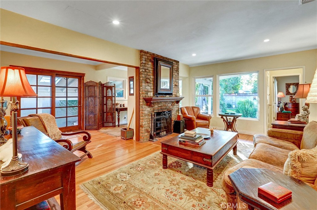 6649 Ranchito Avenue Van Nuys, CA 91405 - Photo 8 of 31 a living room with furniture a large window and flat screen tv