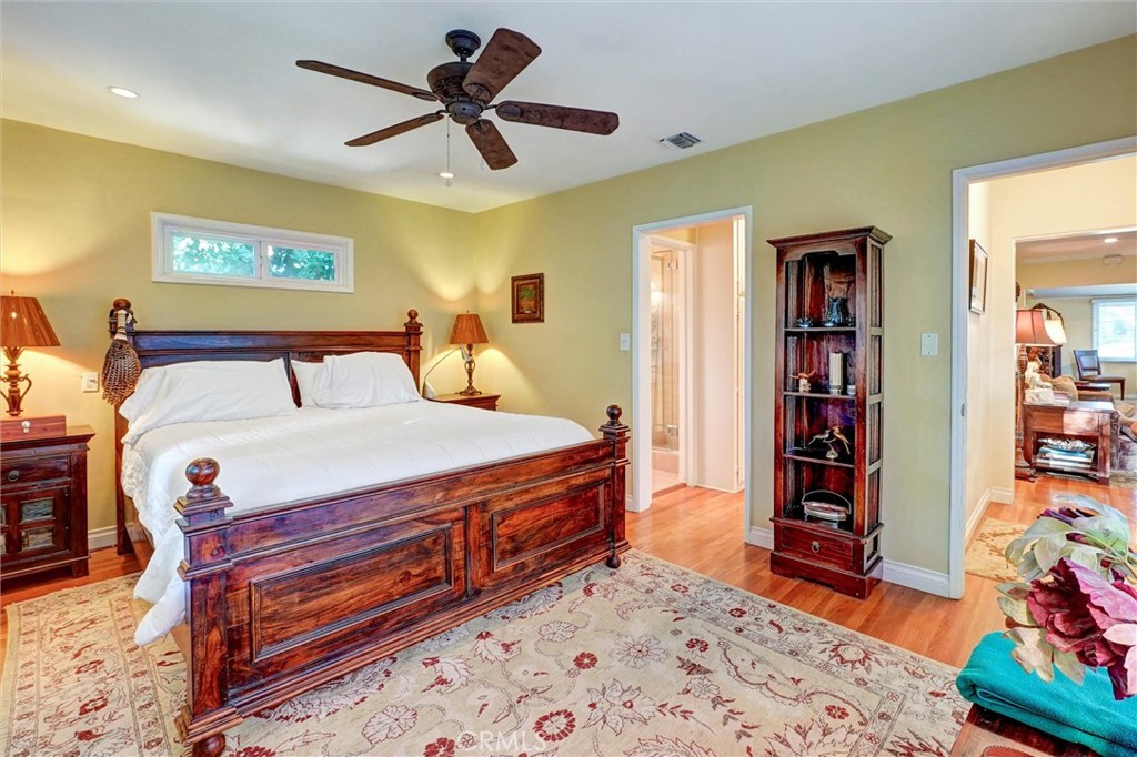 6649 Ranchito Avenue Van Nuys, CA 91405 - Photo 9 of 31 a bedroom with a bed and a bookshelf