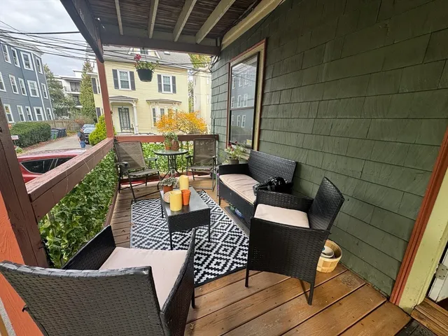 a view of a patio with couches and potted plants