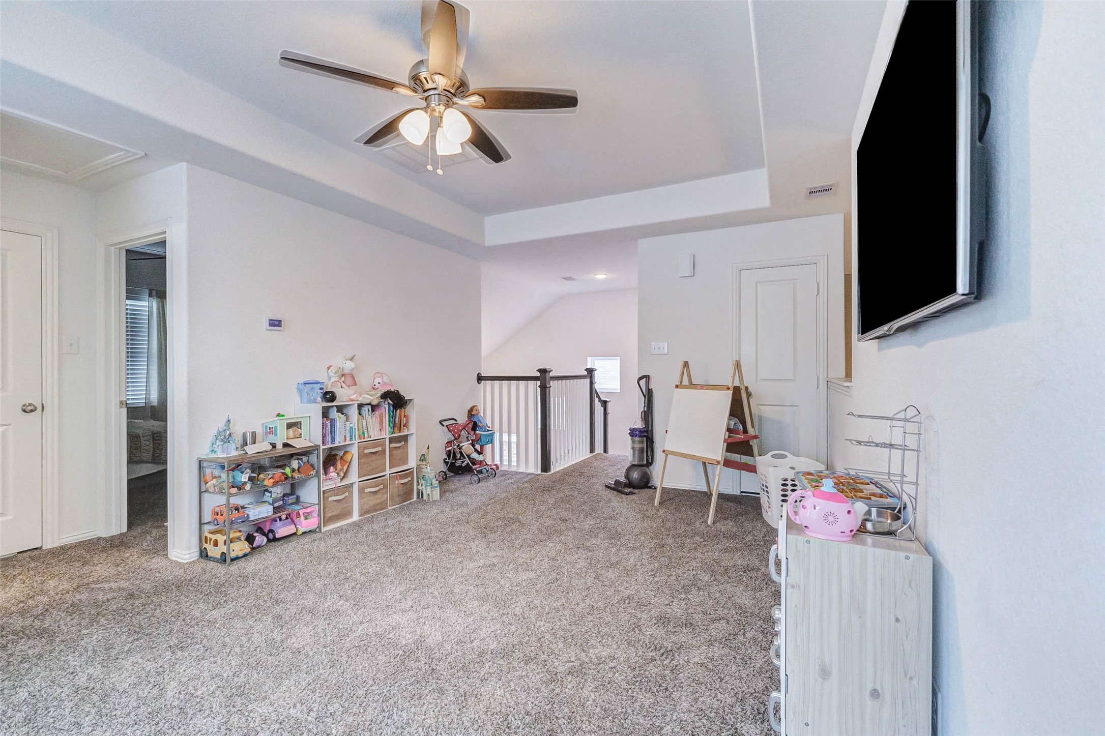 3210 Montclair Orchard Trace Spring, TX 77386 - Photo 20 of 38 a living room with furniture and a flat screen tv