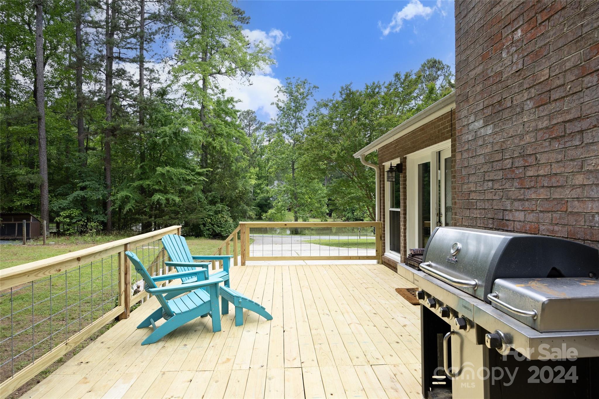 819 Homestead Road Chapel Hill, NC 27516 - Photo 14 of 42 a roof deck with table and chairs and potted plants