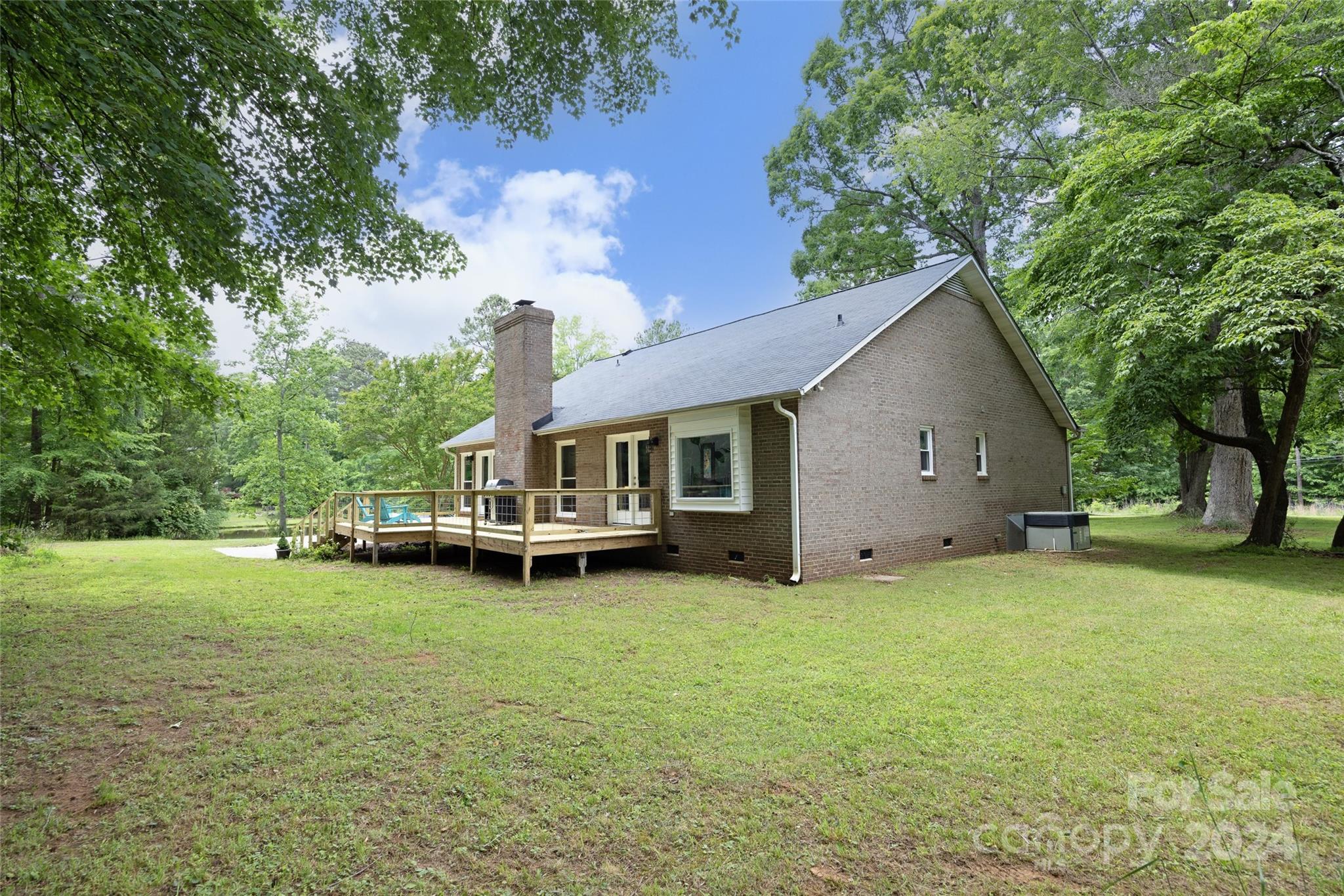 819 Homestead Road Chapel Hill, NC 27516 - Photo 16 of 42 a view of a house with a yard and sitting area