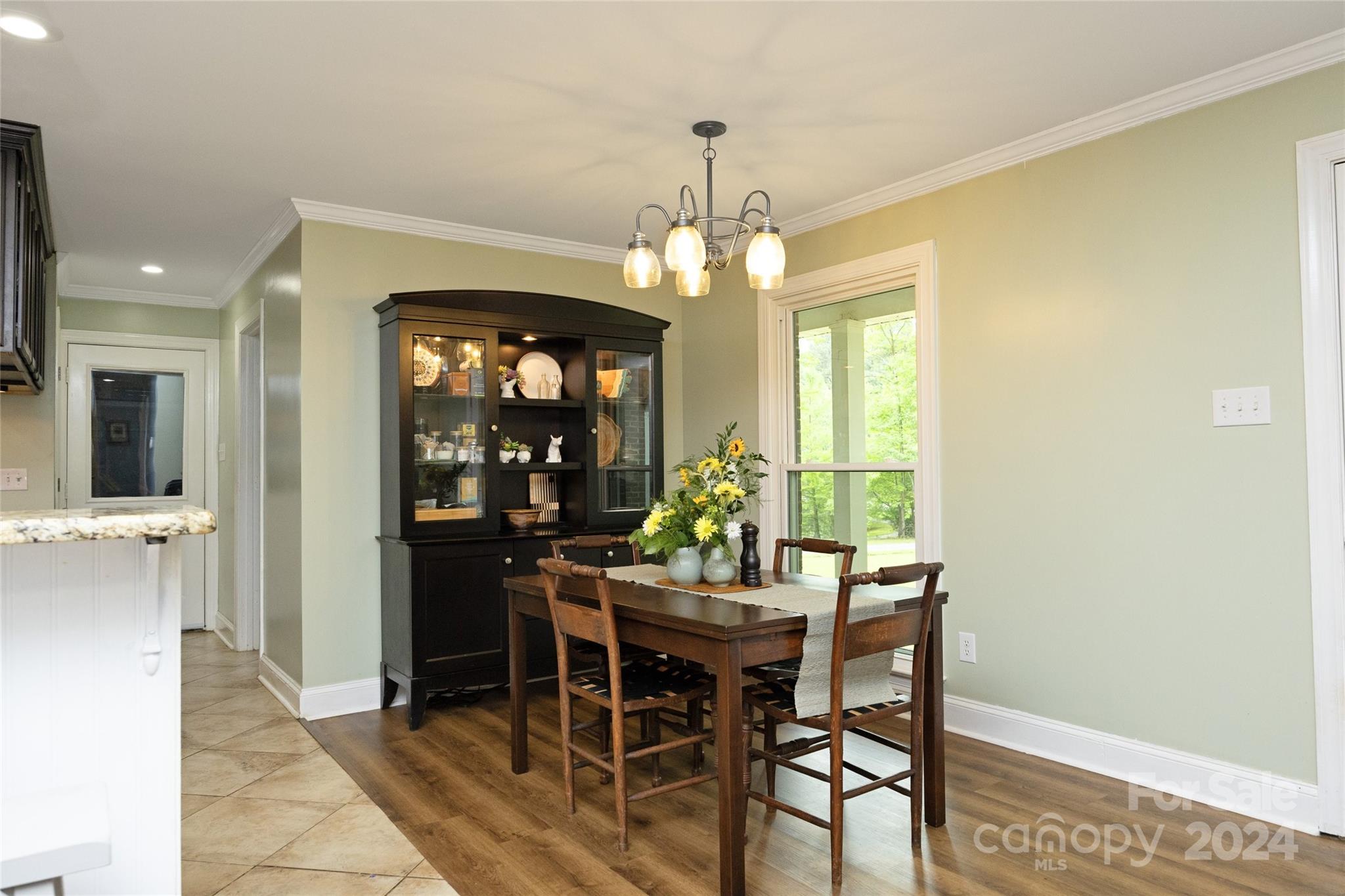 819 Homestead Road Chapel Hill, NC 27516 - Photo 18 of 42 a view of a dining room with furniture and window