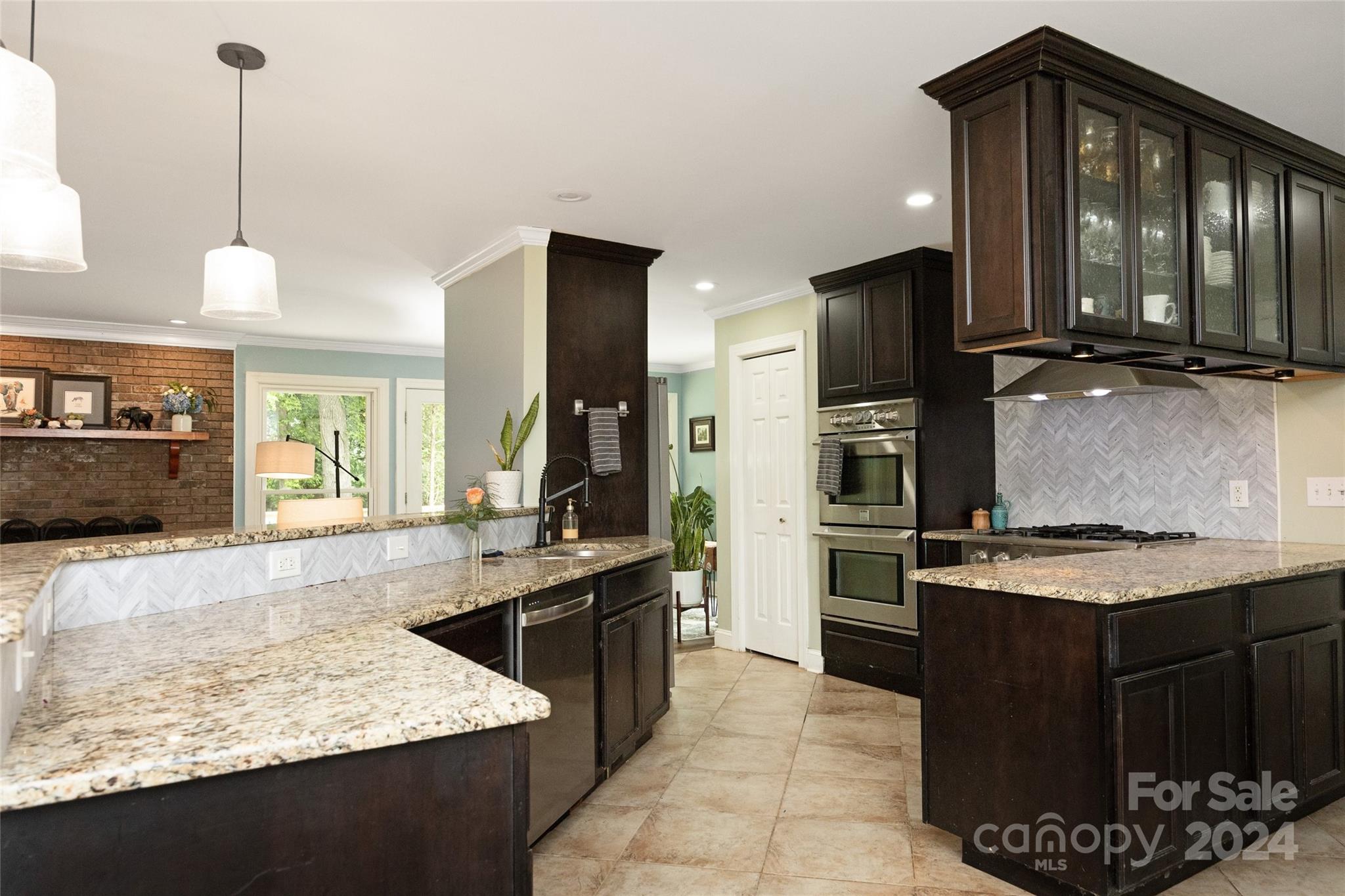 819 Homestead Road Chapel Hill, NC 27516 - Photo 21 of 42 a kitchen with a sink stove and refrigerator