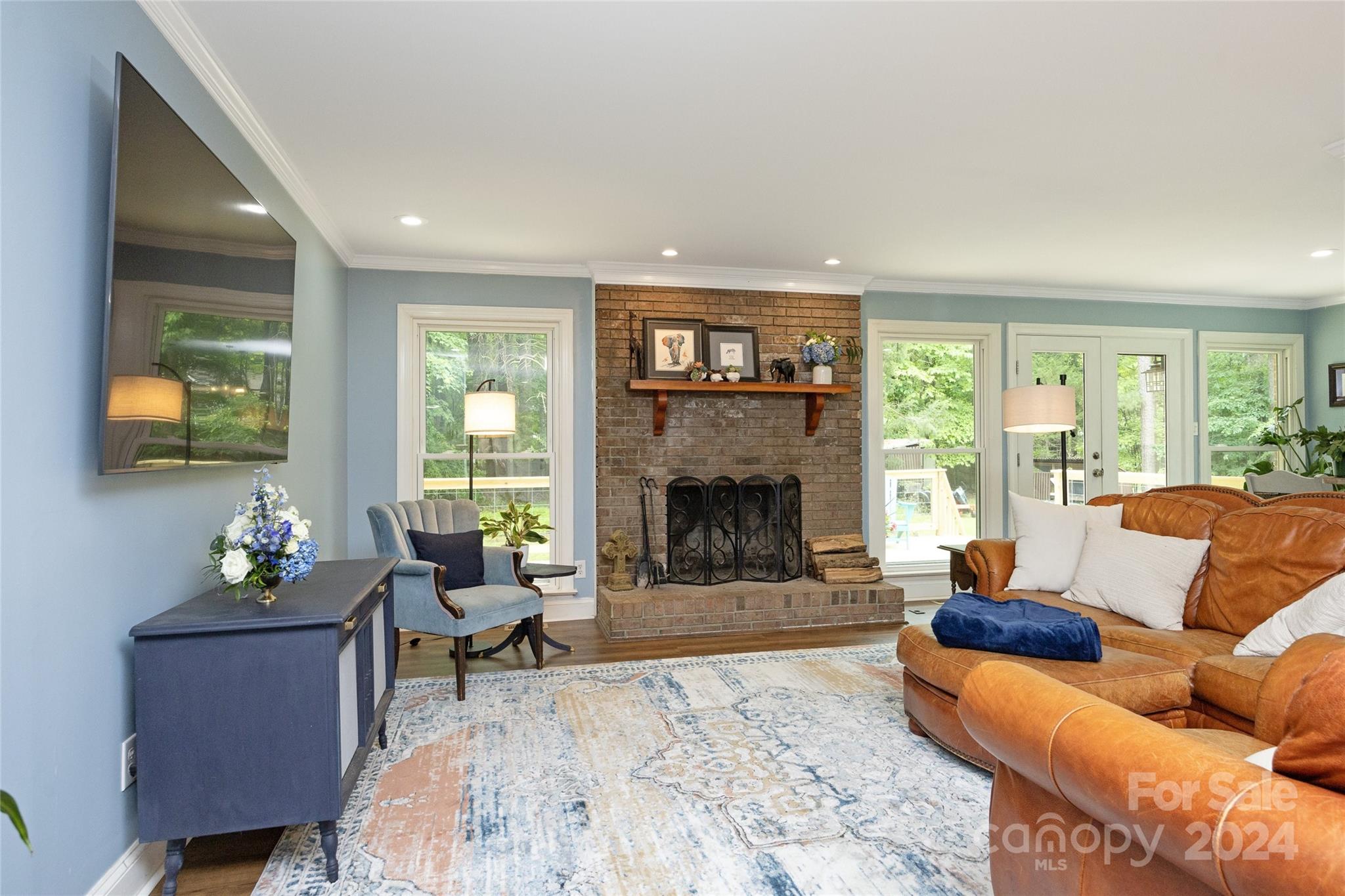 819 Homestead Road Chapel Hill, NC 27516 - Photo 23 of 42 a living room with furniture and a fireplace