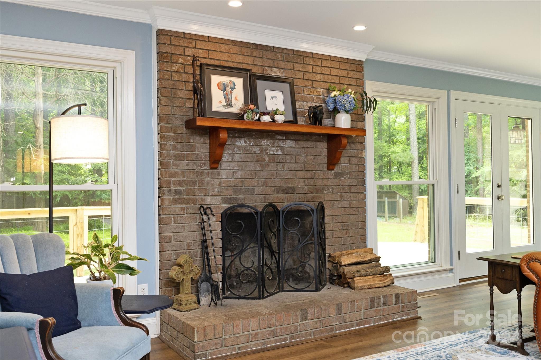 819 Homestead Road Chapel Hill, NC 27516 - Photo 24 of 42 a living room with furniture and a fireplace