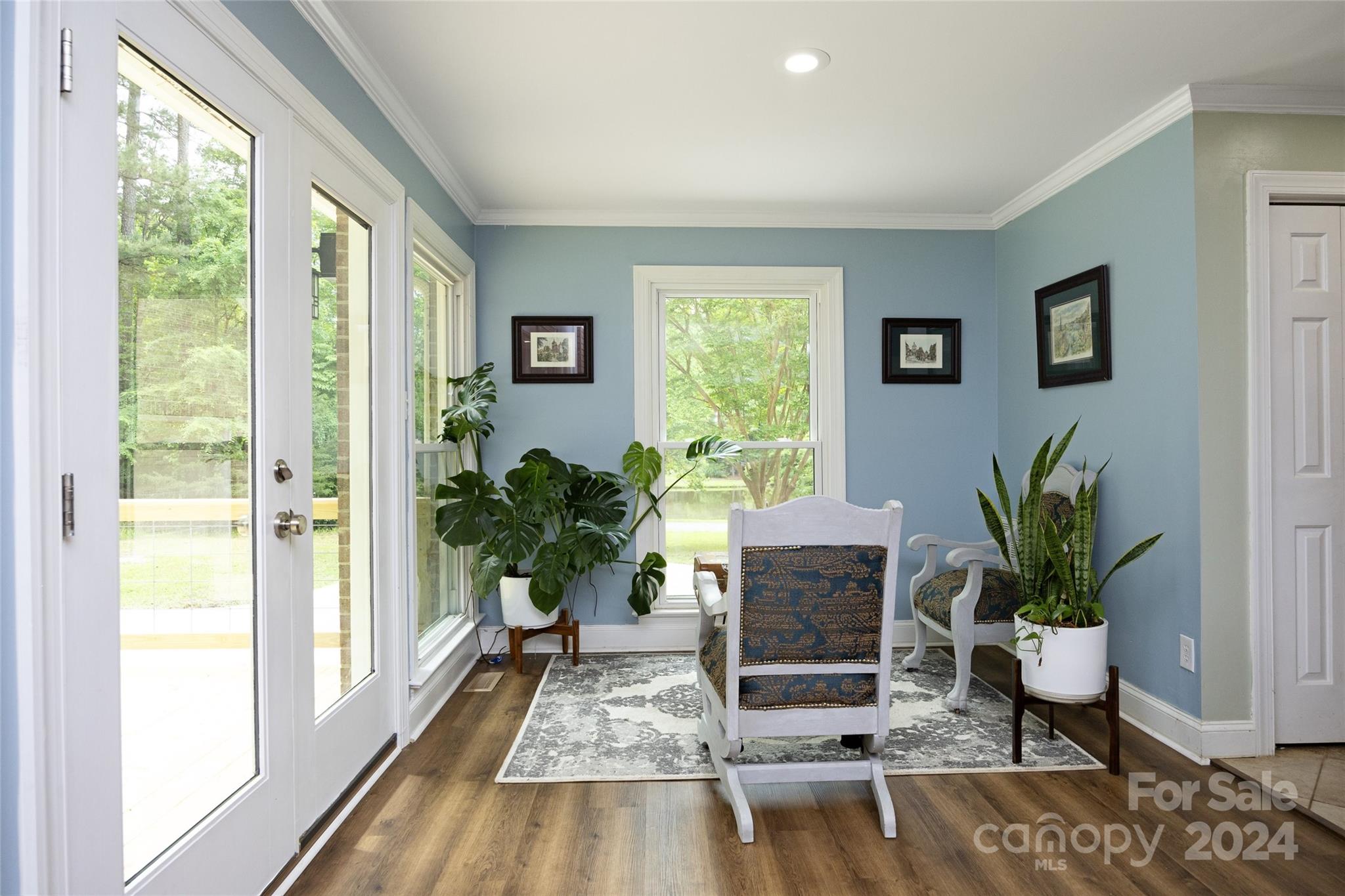 819 Homestead Road Chapel Hill, NC 27516 - Photo 26 of 42 a living room with furniture and a potted plant