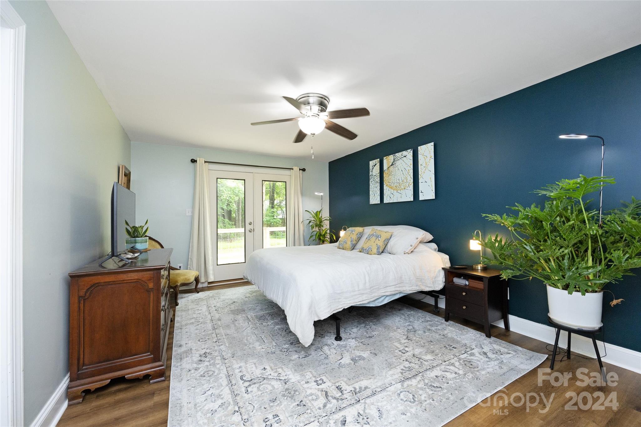819 Homestead Road Chapel Hill, NC 27516 - Photo 29 of 42 a bed sitting in a spacious bedroom next to a window