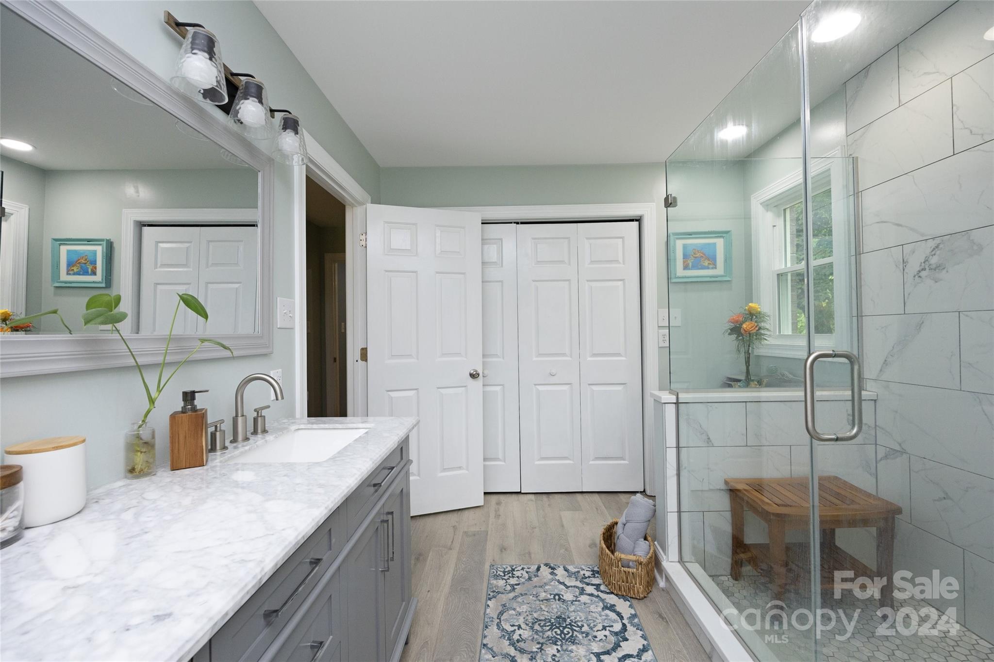 819 Homestead Road Chapel Hill, NC 27516 - Photo 32 of 42 a bathroom with a granite countertop sink a toilet and shower