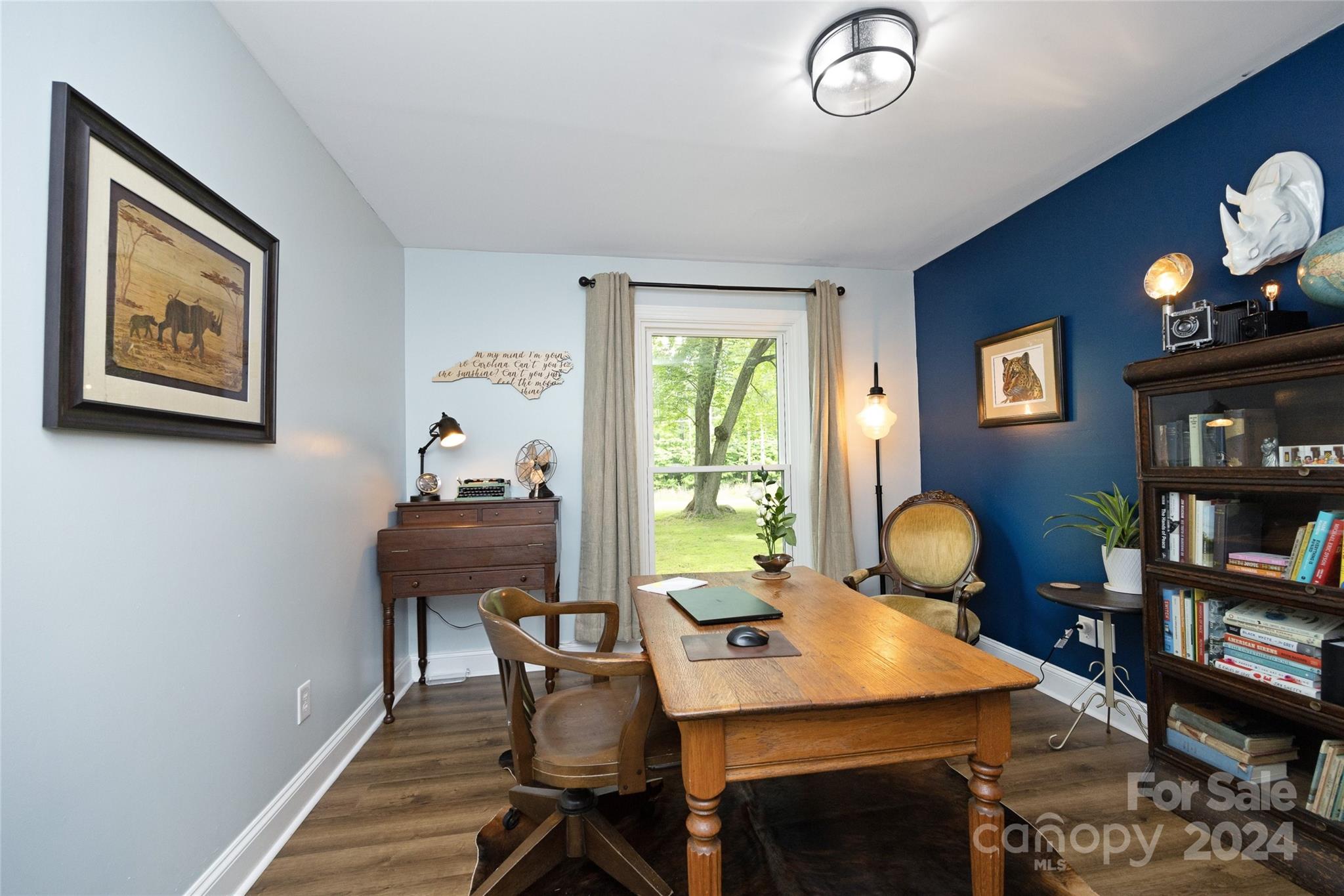 819 Homestead Road Chapel Hill, NC 27516 - Photo 36 of 42 a view of a workspace with furniture and a potted plant