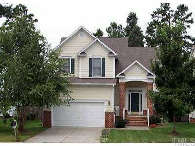 12313 Hartwick Court Raleigh, NC 27613 - Photo 1 of 1 a front view of a house with a yard and trees