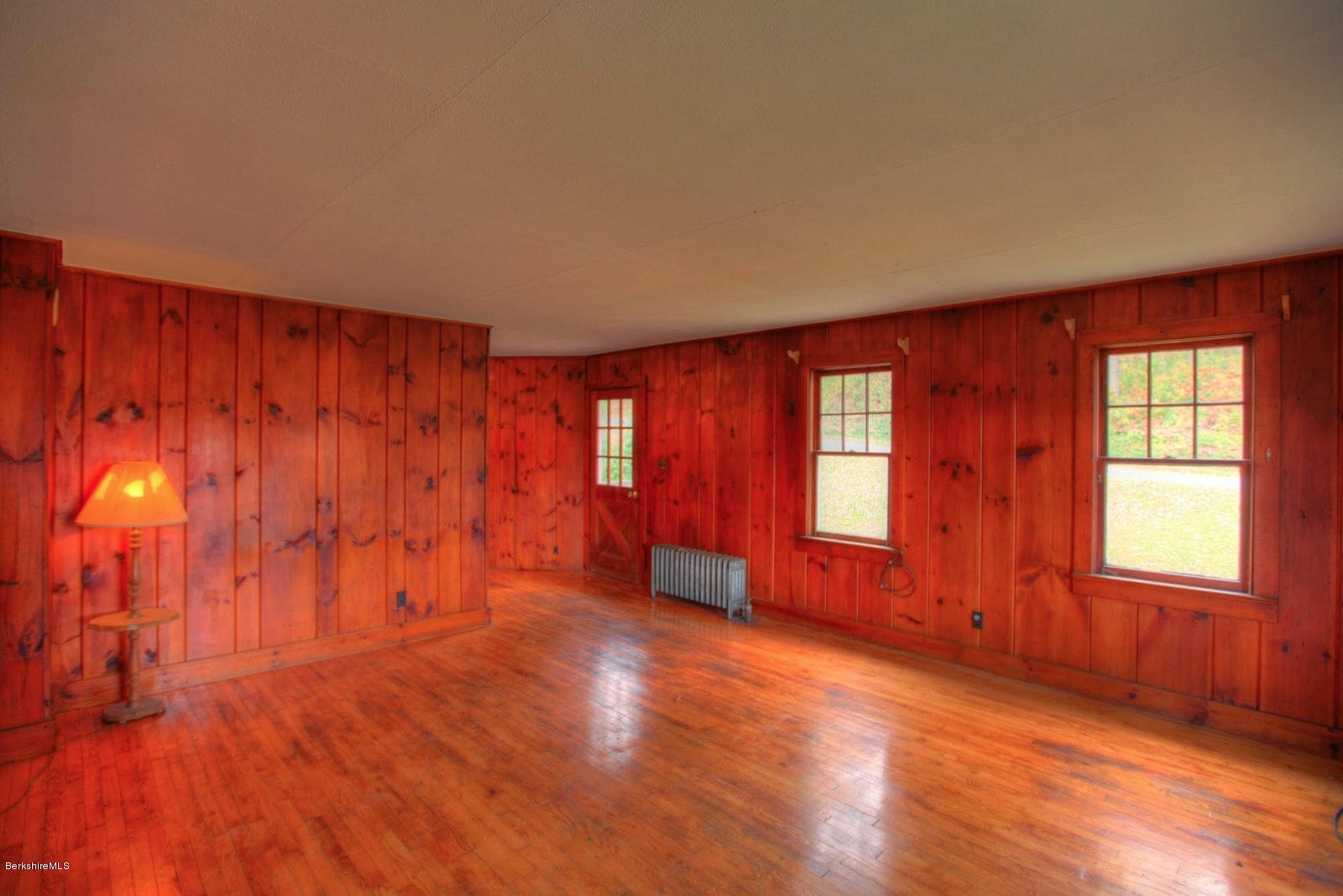 25 Jerusalem Road Tyringham, MA 01264 - Photo 12 of 30 an empty room with wooden floor and windows