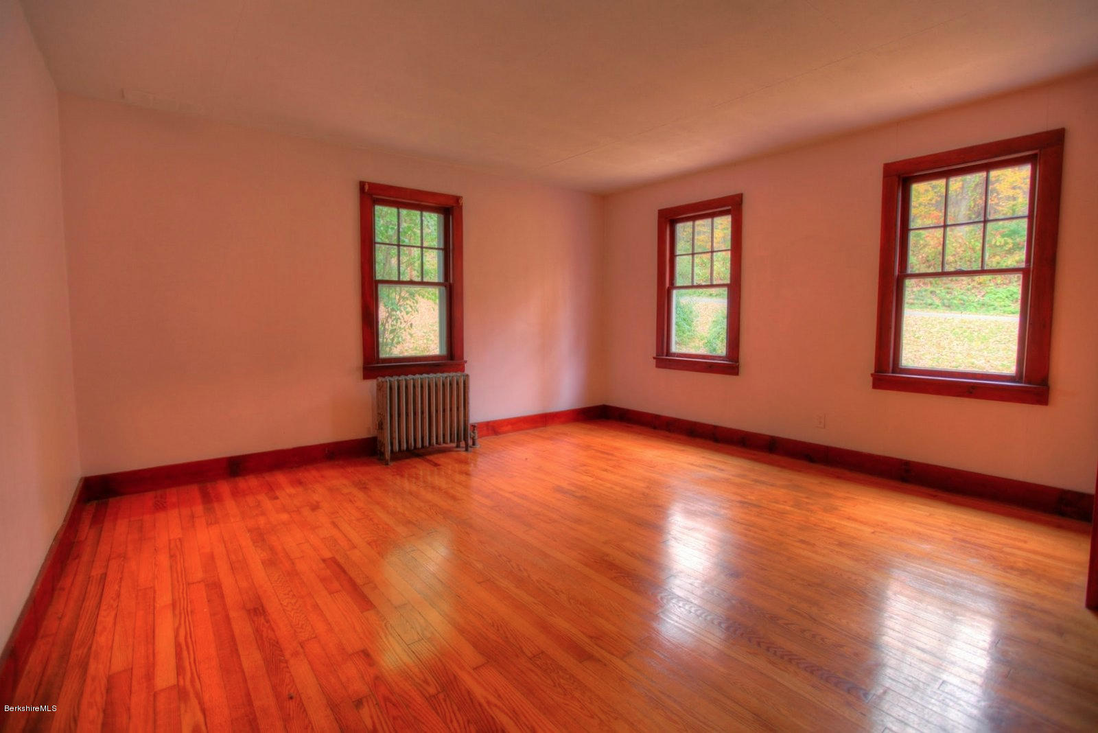 25 Jerusalem Road Tyringham, MA 01264 - Photo 14 of 30 a view of an empty room with wooden floor and windows