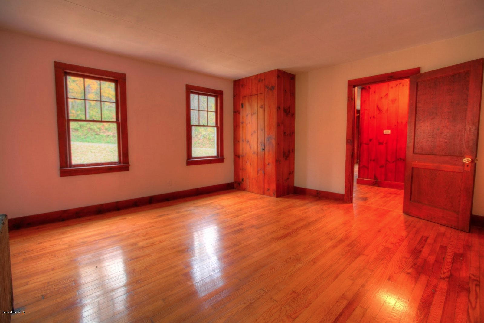 25 Jerusalem Road Tyringham, MA 01264 - Photo 15 of 30 an empty room with wooden floor and windows