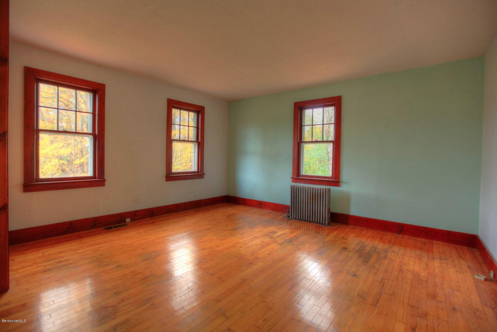 25 Jerusalem Road Tyringham, MA 01264 - Photo 16 of 30 an empty room with wooden floor and windows