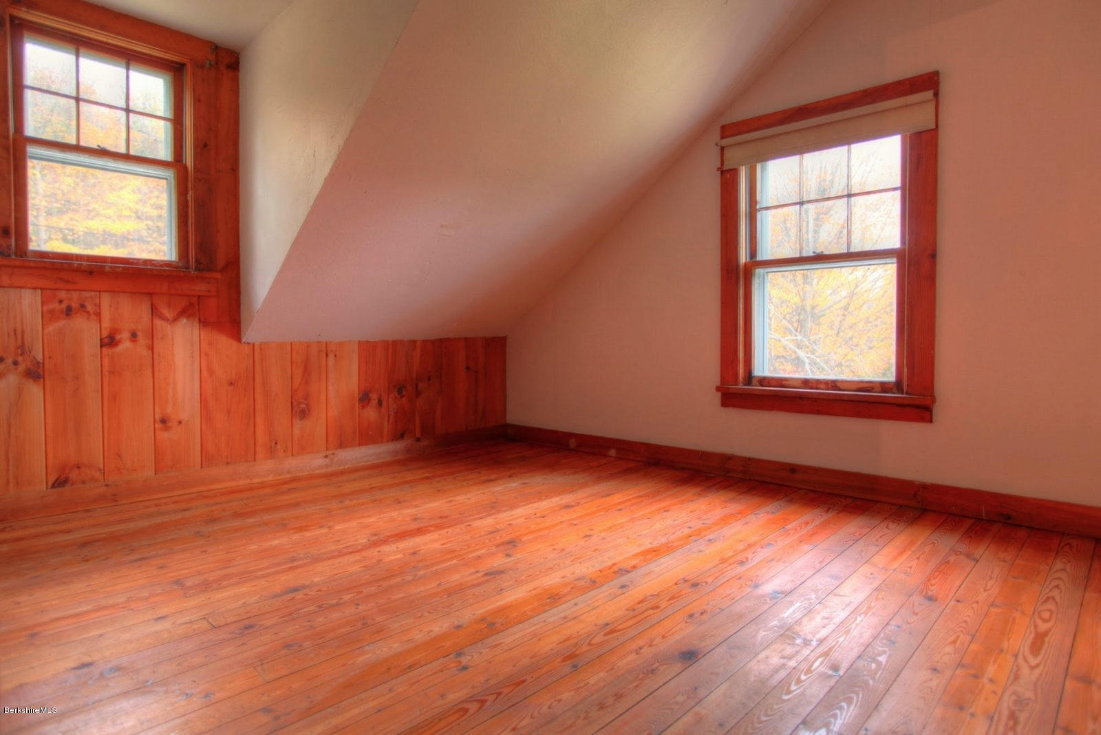 25 Jerusalem Road Tyringham, MA 01264 - Photo 20 of 30 an empty room with wooden floor and windows
