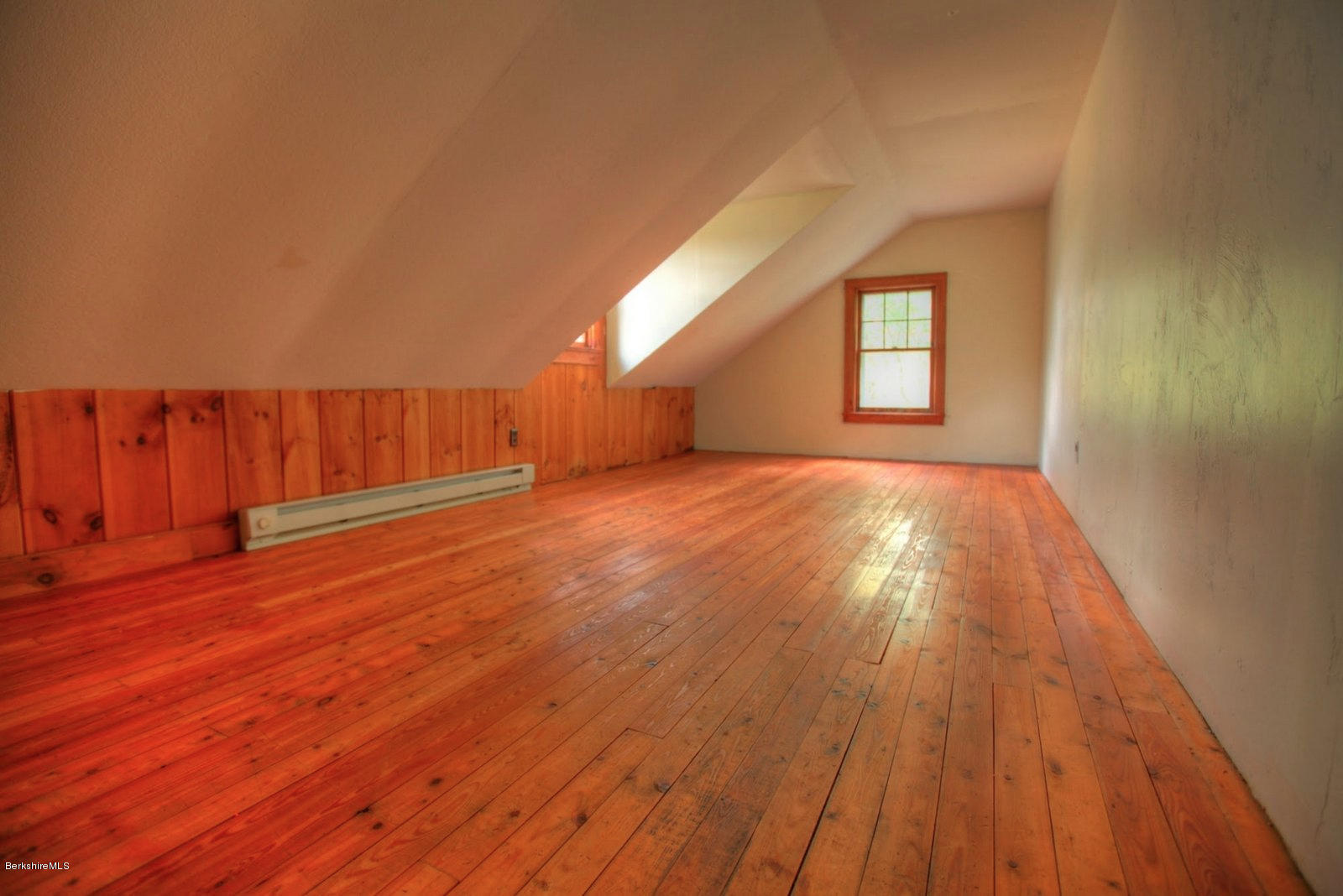 25 Jerusalem Road Tyringham, MA 01264 - Photo 21 of 30 a view of an empty room and wooden floor