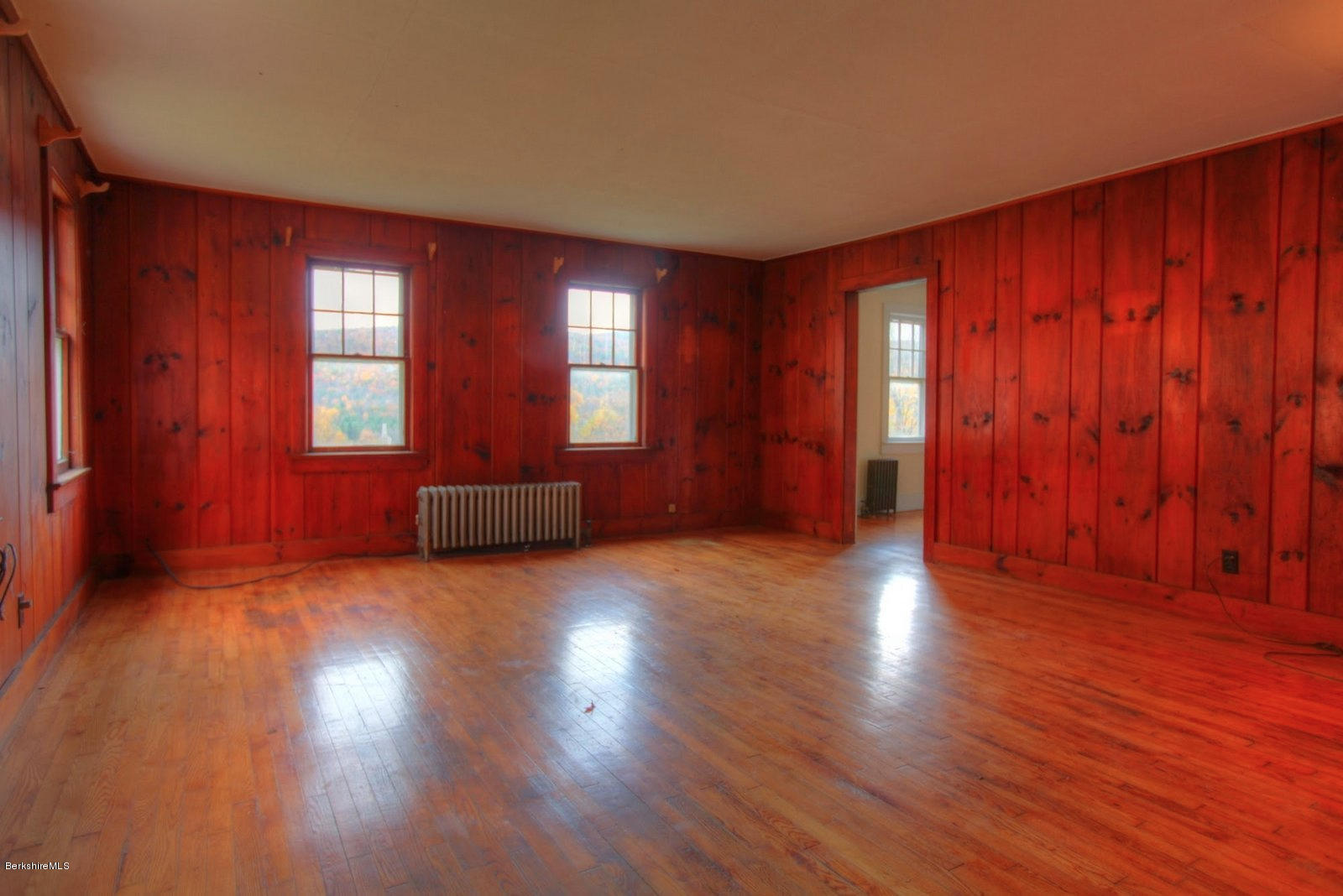 25 Jerusalem Road Tyringham, MA 01264 - Photo 24 of 30 an empty room with wooden floor and windows