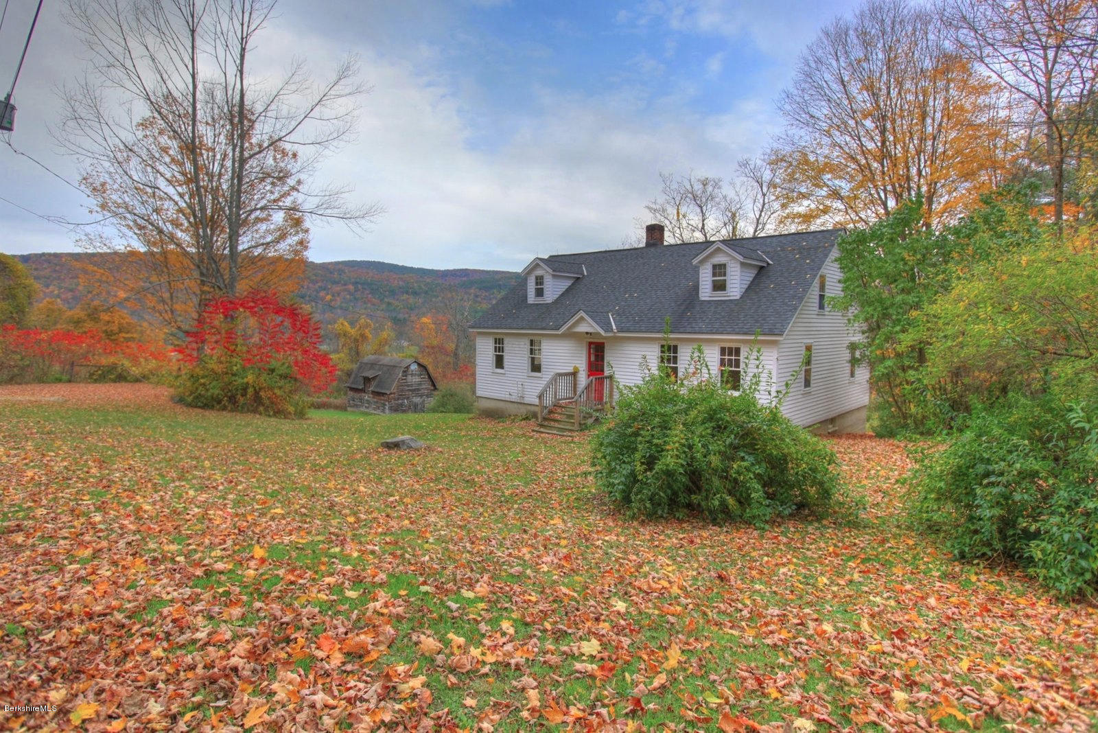 25 Jerusalem Road Tyringham, MA 01264 - Photo 3 of 30 a front view of house with yard and trees around
