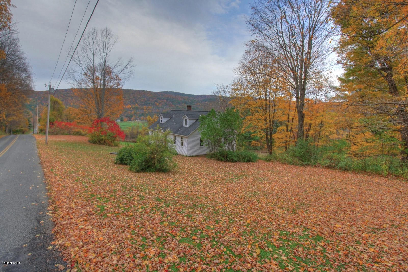25 Jerusalem Road Tyringham, MA 01264 - Photo 7 of 30 a view of a road with a building in the background