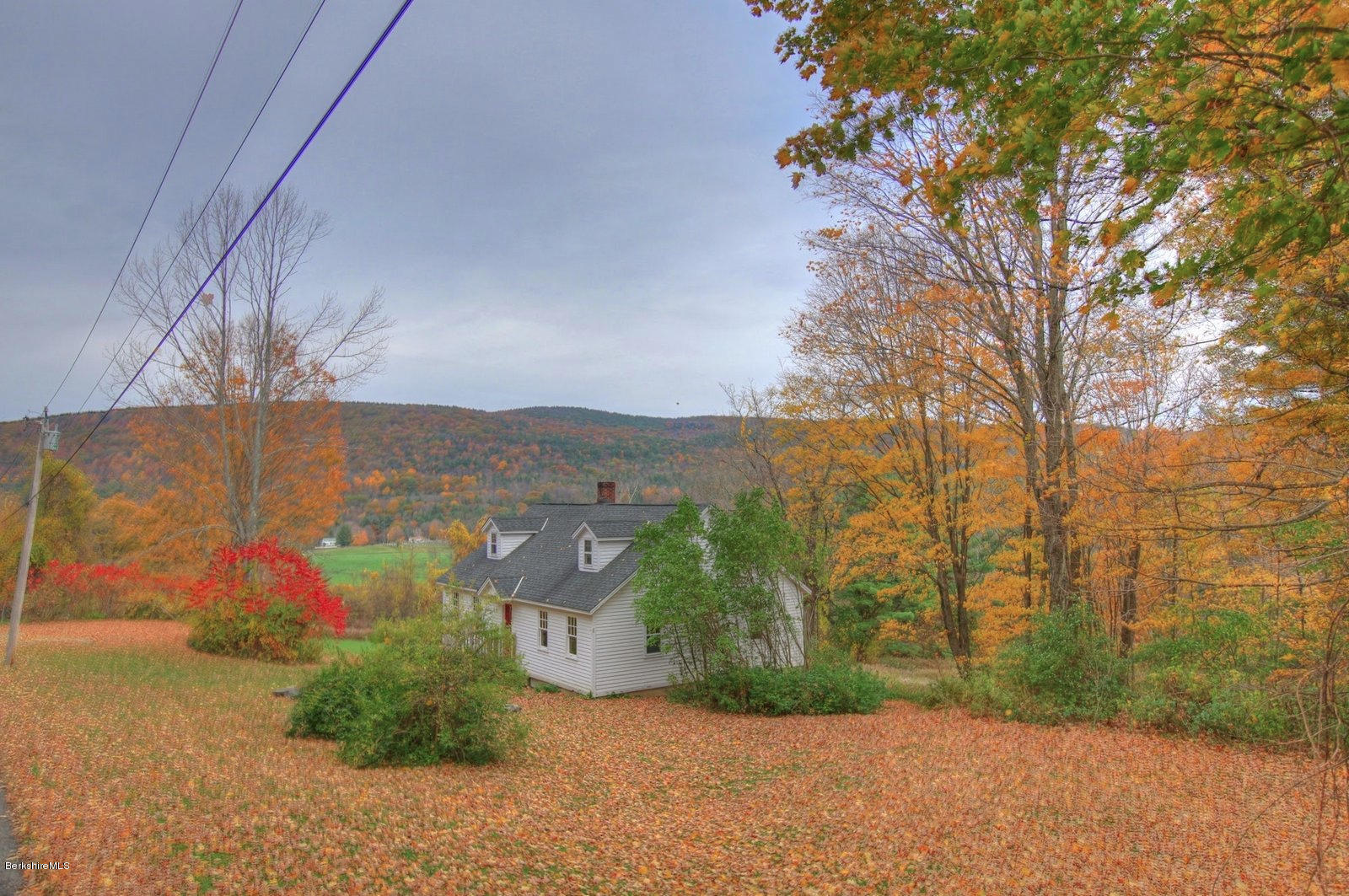 25 Jerusalem Road Tyringham, MA 01264 - Photo 8 of 30 a view of a road with a building in the background
