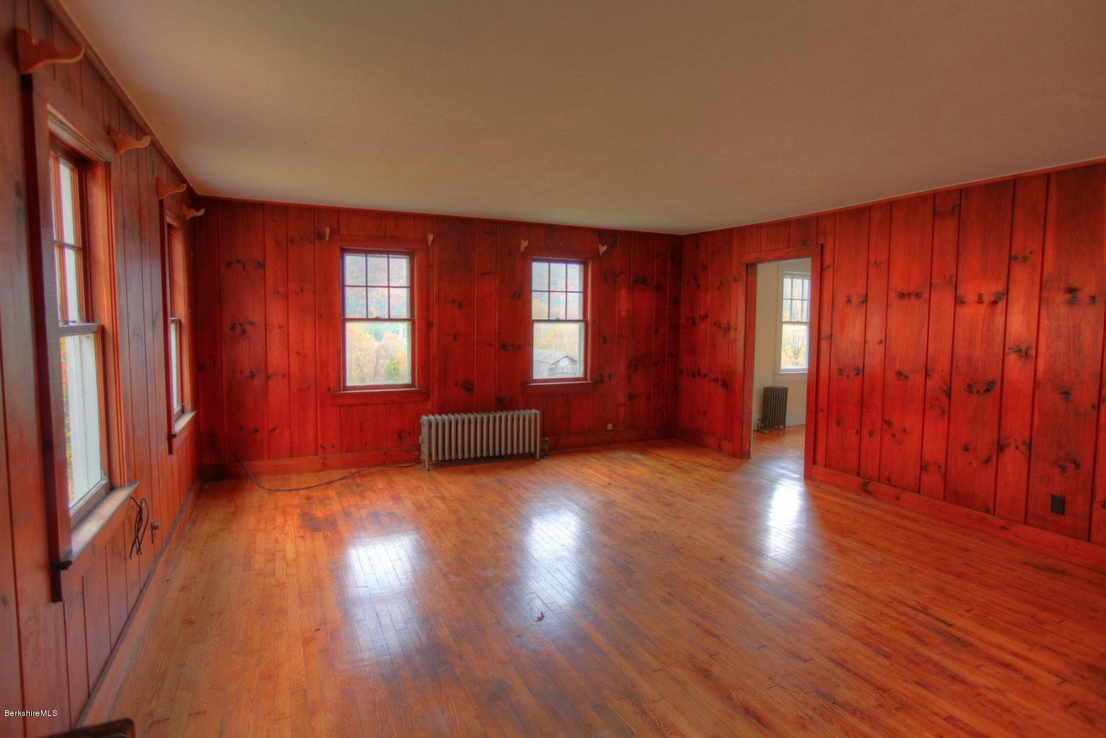 25 Jerusalem Road Tyringham, MA 01264 - Photo 10 of 30 an empty room with wooden floor and windows