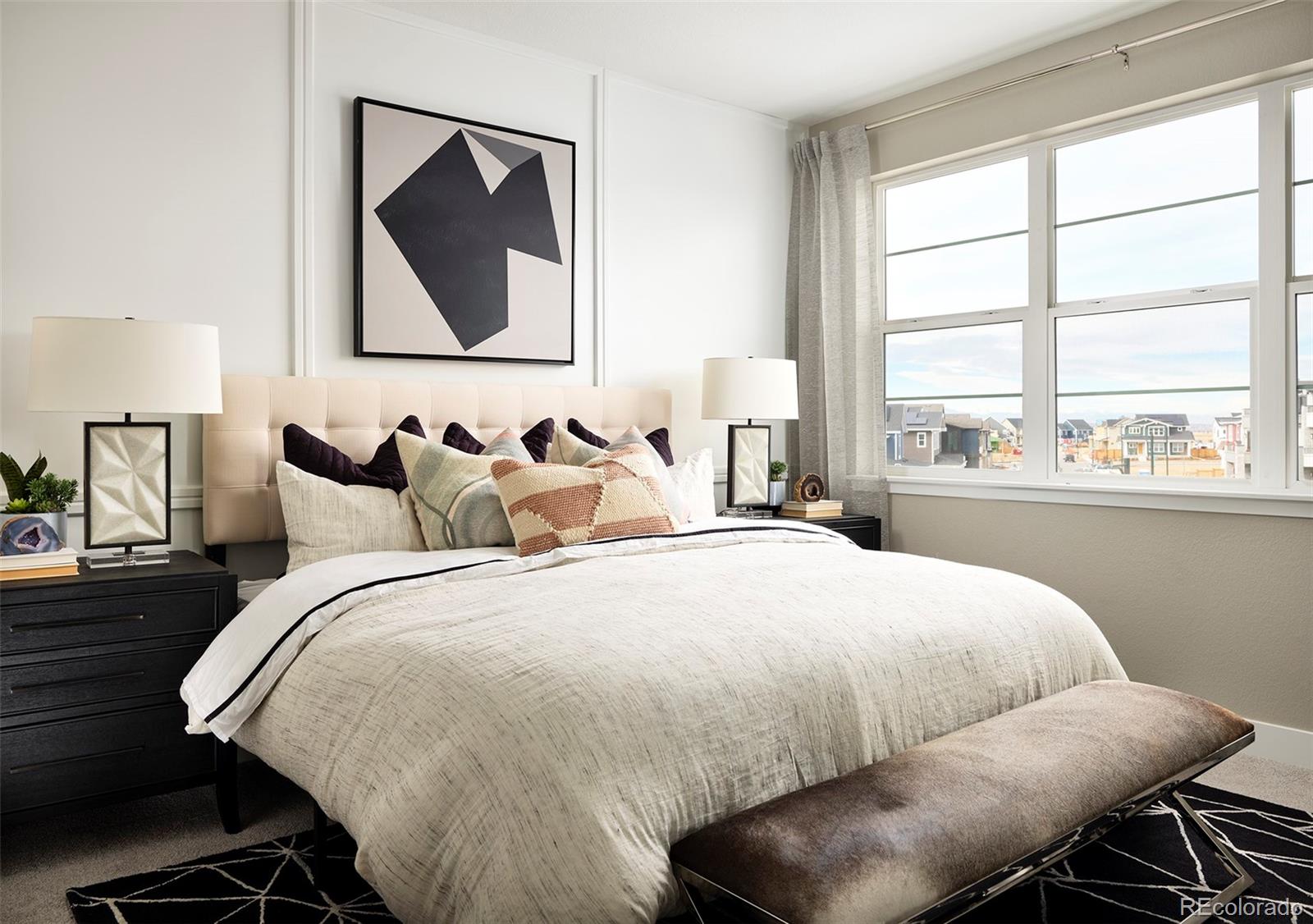 Undisclosed Address Denver, CO 80238 - Photo 15 of 21 a bedroom with a bed and a large window