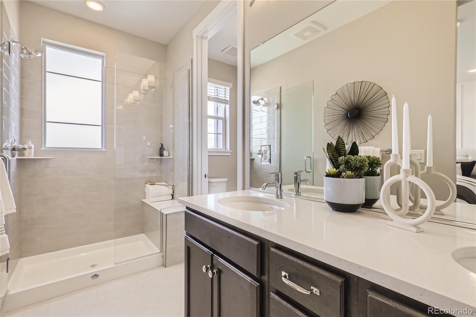Undisclosed Address Denver, CO 80238 - Photo 16 of 21 a bathroom with a sink a toilet and shower
