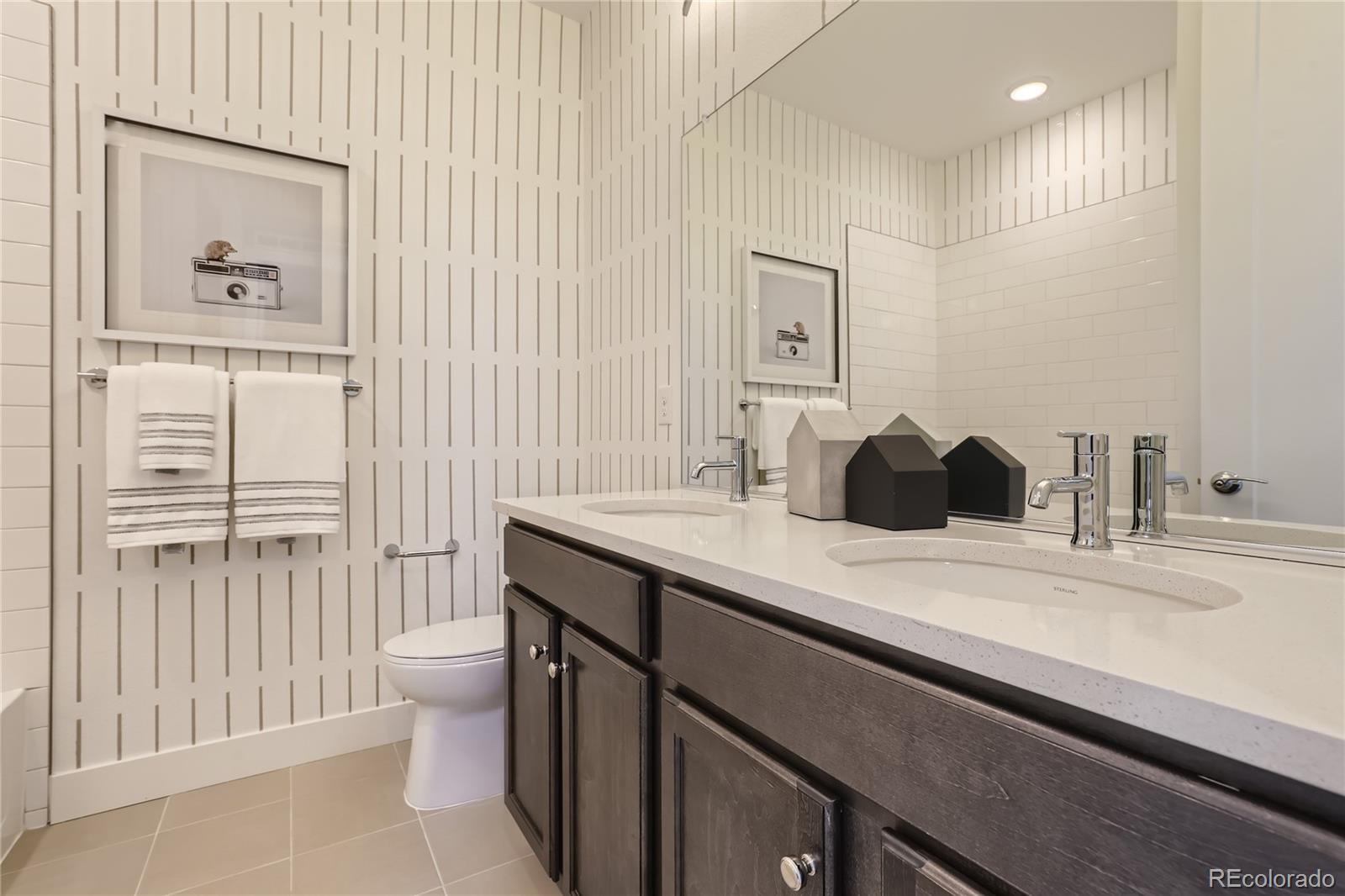 Undisclosed Address Denver, CO 80238 - Photo 19 of 21 a bathroom with a sink a toilet and shower