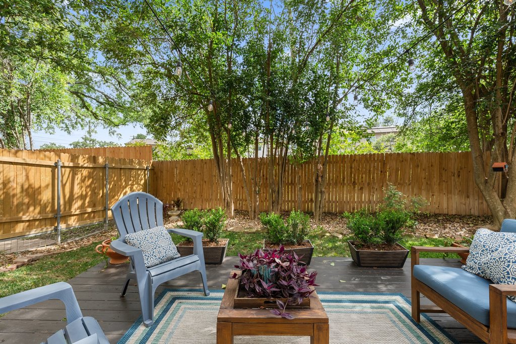 6708 Menchaca Road, Unit 2 Austin, TX 78745 - Photo 27 of 30 Backyard patio featuring wood-finish decking and a wooden privacy fence