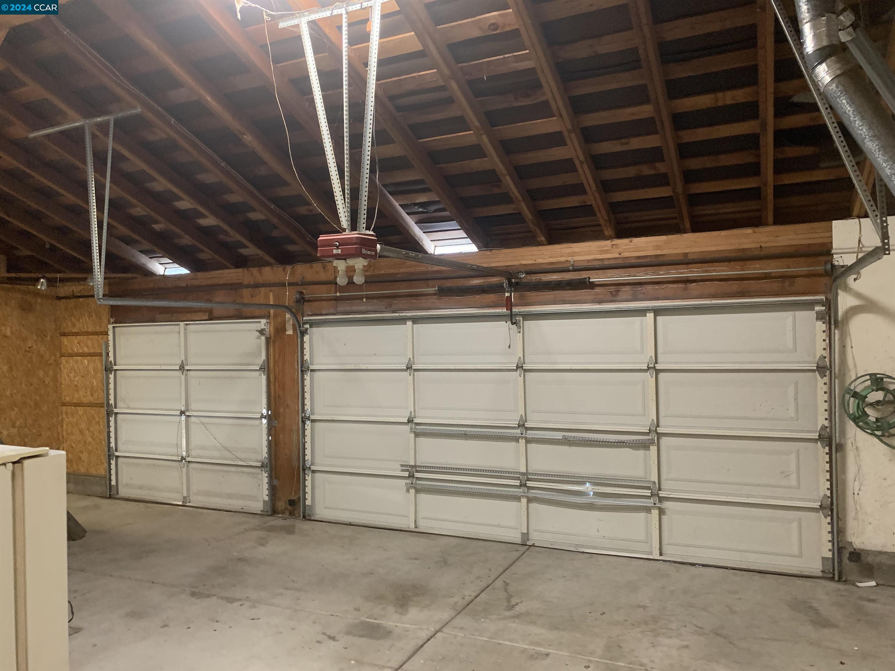 9462 Thunderbird Place San Ramon, CA 94583 - Photo 5 of 17 a view of a room with racks on the wall