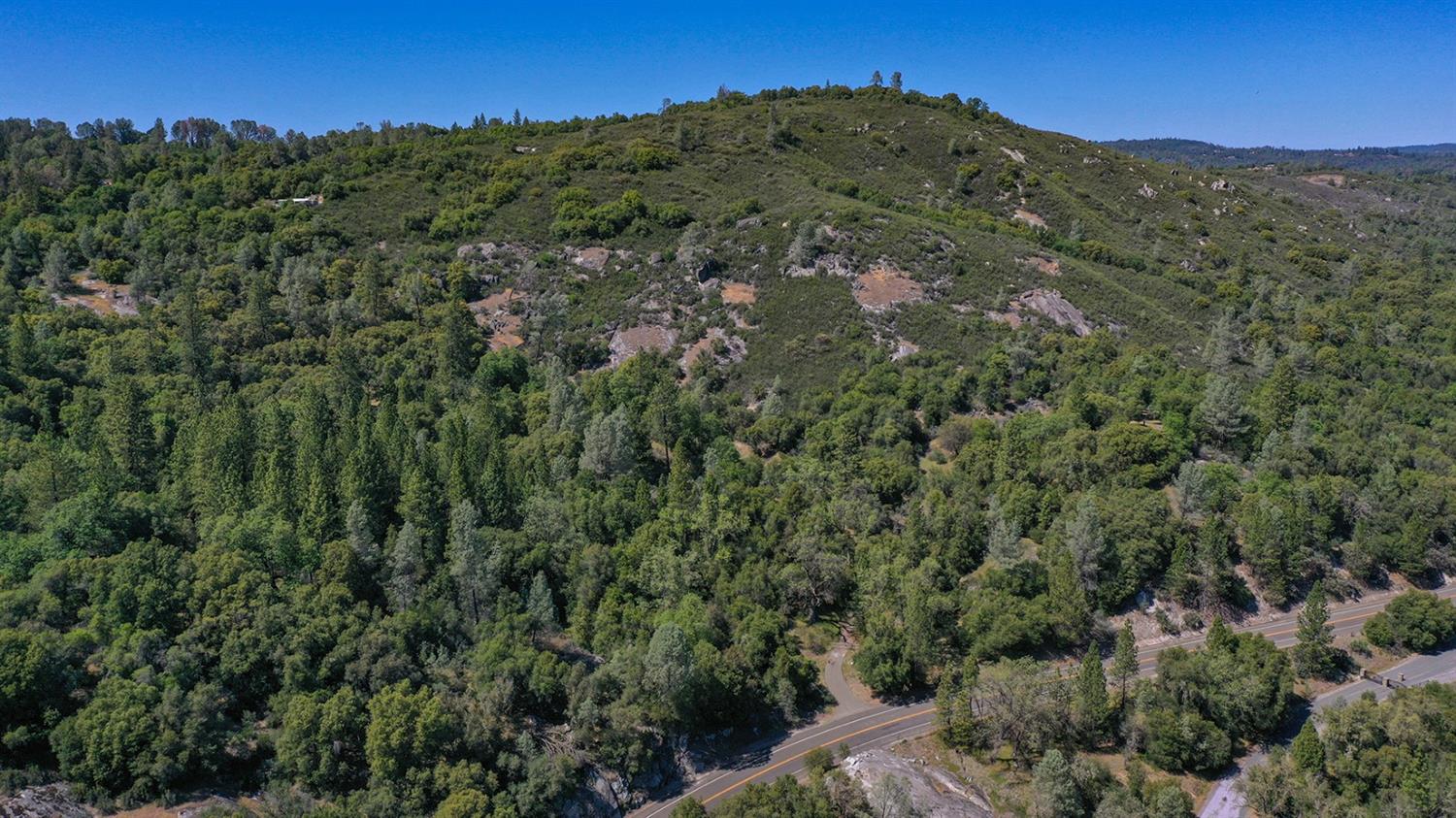 6412 Mt Aukum Road Somerset, CA 95684 - Photo 33 of 65 a view of a large building with a mountain in the background