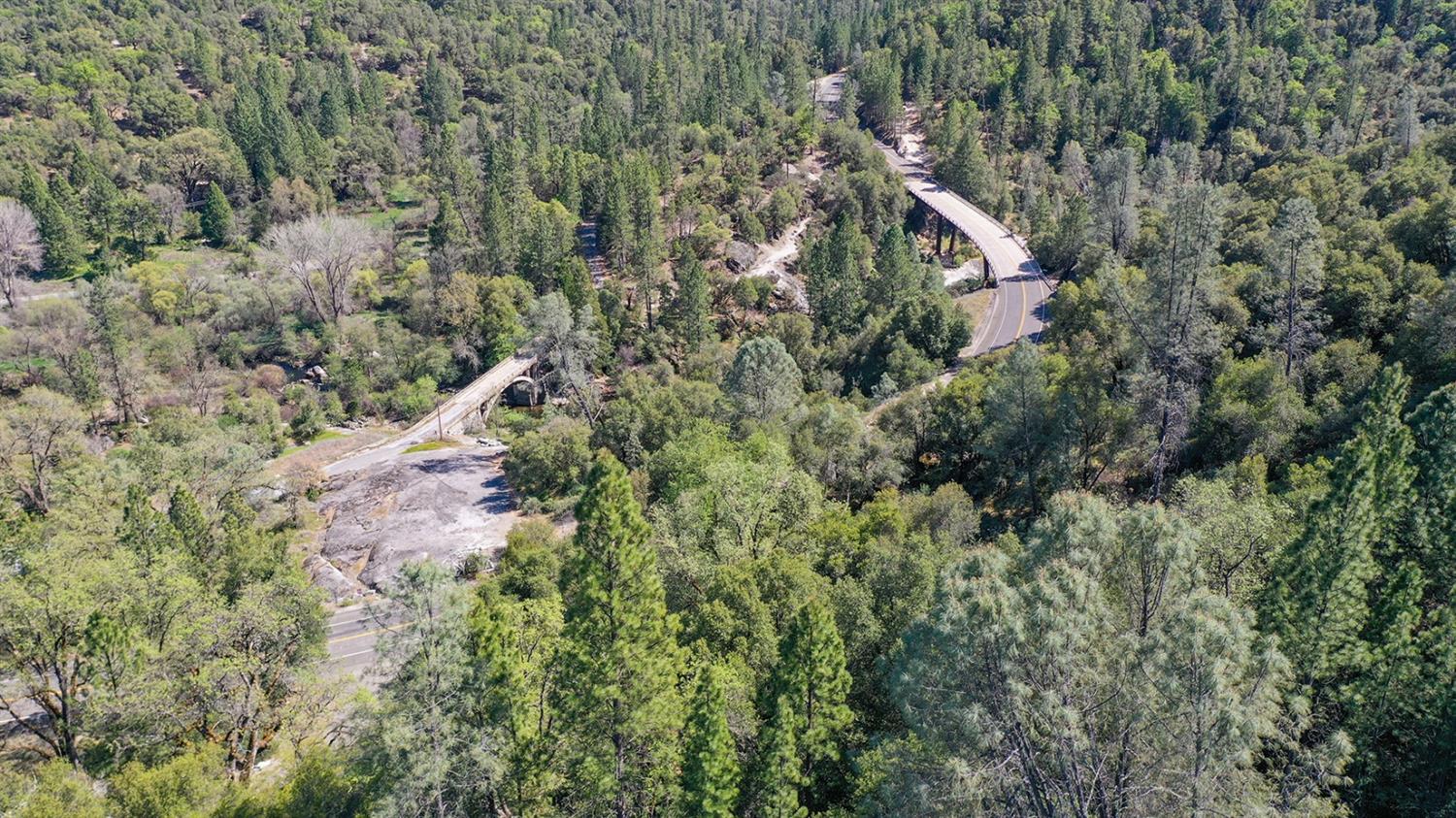 6412 Mt Aukum Road Somerset, CA 95684 - Photo 59 of 65 a view of a house with a lush green forest